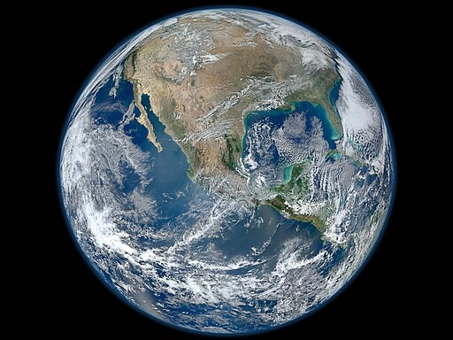Vista del planeta Tierra desde el espacio, con América Central y del Norte visibles, en una imagen que resalta la fragilidad del planeta frente al cambio climático.